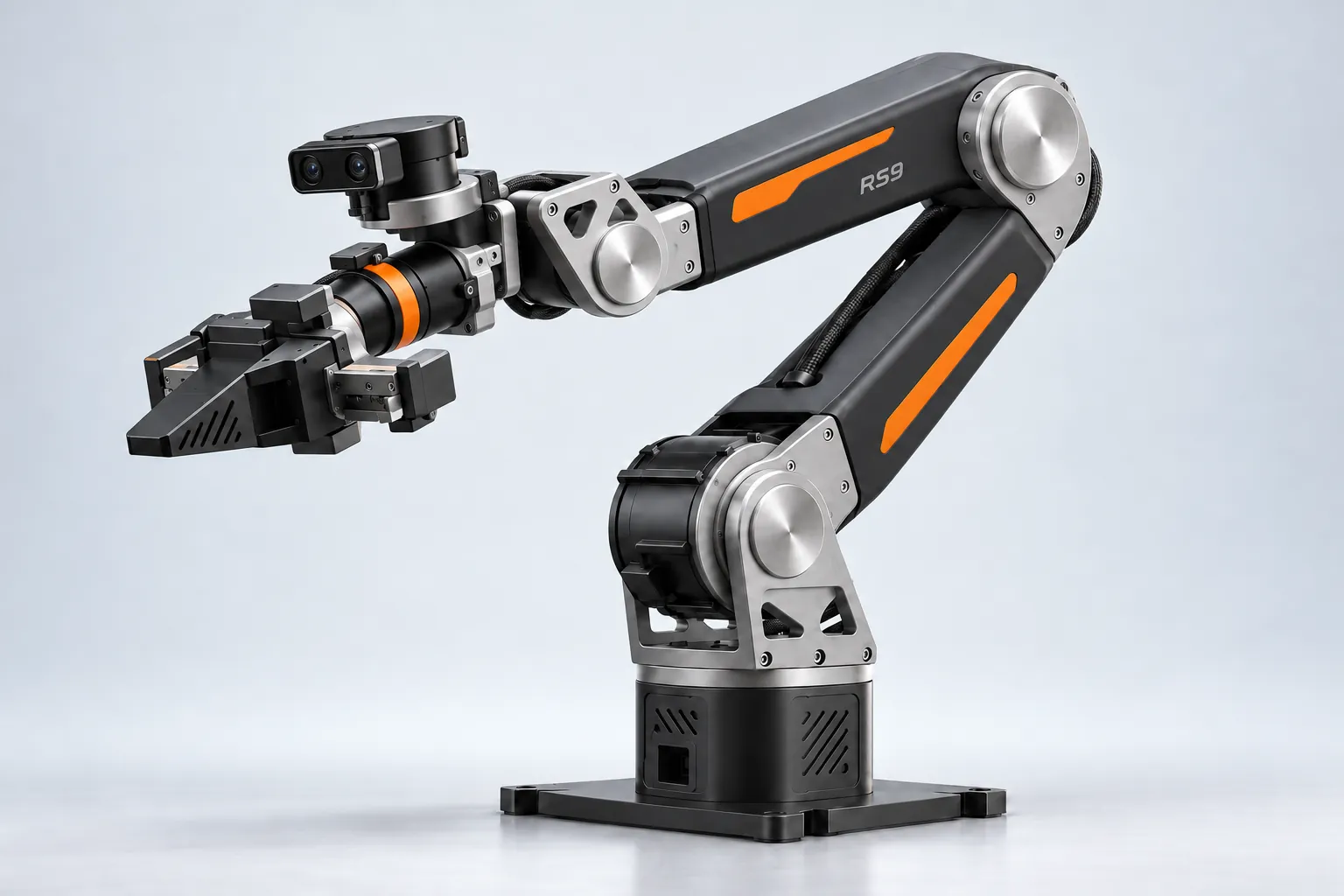 Tælon T1 benchtop robot arm in graphite with orange accents, gripper extended